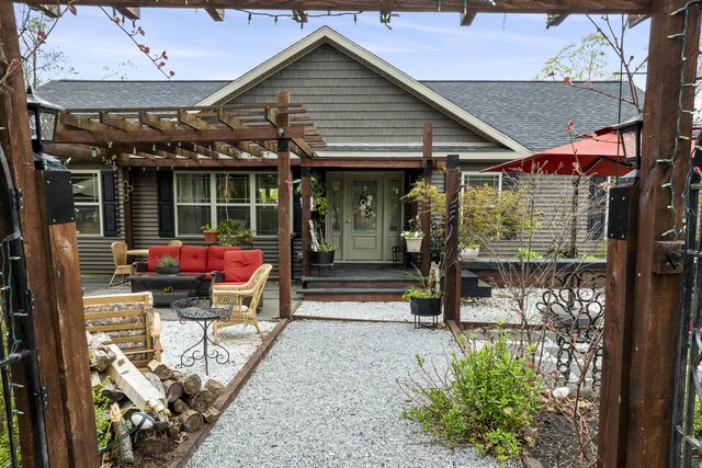 85 Lions Ridge Rd, Alna, ME 04535 - back of house featuring a shingled roof, a pergola, outdoor lounge area, and a patio