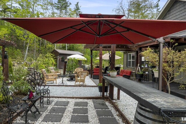 85 Lions Ridge Rd, Alna, ME 04535 - view of patio featuring an outdoor fire pit