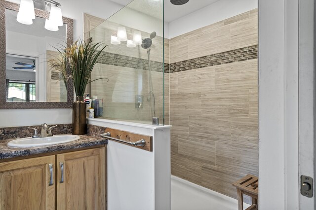 85 Lions Ridge Rd, Alna, ME 04535 - bathroom featuring a tile shower, vanity, and ceiling fan