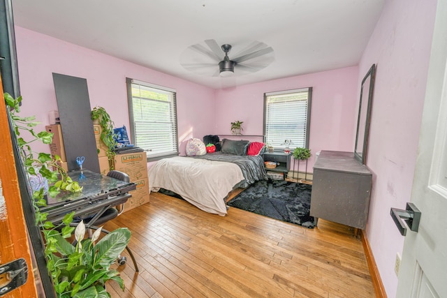 48 Griffin Ave, Hampden, ME 04444 - bedroom featuring hardwood / wood-style flooring, baseboard heating, and a ceiling fan