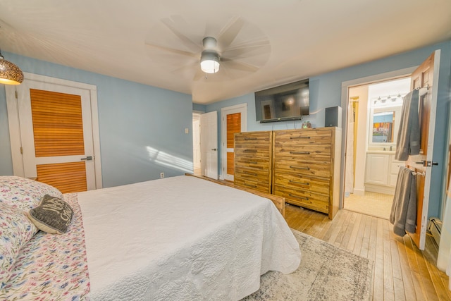 48 Griffin Ave, Hampden, ME 04444 - bedroom with light wood-type flooring, ceiling fan, and ensuite bathroom