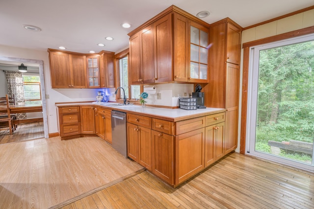 48 Griffin Ave, Hampden, ME 04444 - kitchen featuring stainless steel dishwasher, light wood-style flooring, brown cabinets, light countertops, and recessed lighting