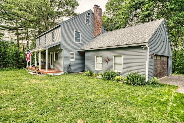 48 Griffin Ave, Hampden, ME 04444 - back of house with a lawn, covered porch, a chimney, roof with shingles, and driveway