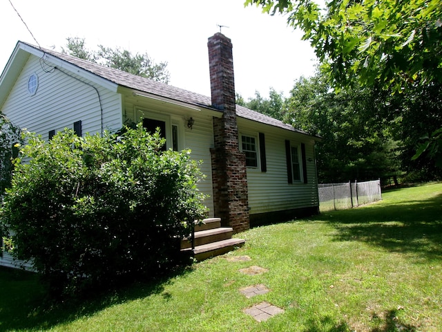 76 Gile Rd, Fayette, ME 04349 - rear view of house with a chimney and roof with shingles