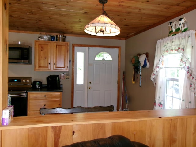 76 Gile Rd, Fayette, ME 04349 - kitchen with appliances with stainless steel finishes, wood ceiling, decorative light fixtures, ornamental molding, and a peninsula