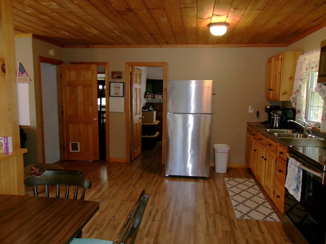 76 Gile Rd, Fayette, ME 04349 - kitchen with freestanding refrigerator, range, ornamental molding, light wood-style flooring, and wooden ceiling