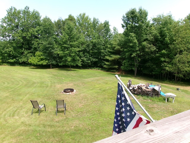 76 Gile Rd, Fayette, ME 04349 - view of green lawn featuring a fire pit