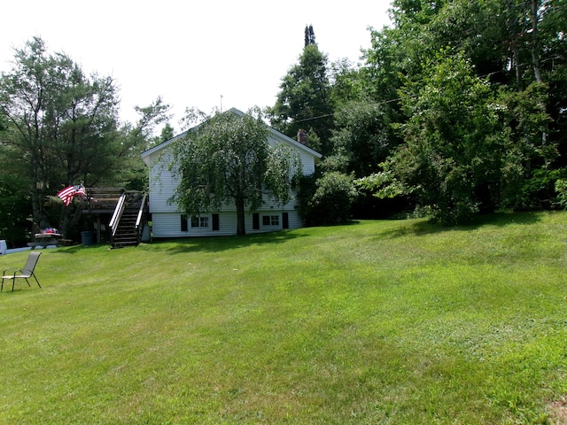 76 Gile Rd, Fayette, ME 04349 - view of green lawn featuring stairway and a deck