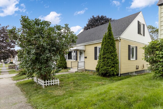 95 Webber Ave, Lewiston, ME 04240 - view of front of property featuring a front lawn and a shingled roof