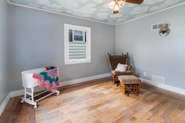 95 Webber Ave, Lewiston, ME 04240 - living area featuring a ceiling fan, hardwood / wood-style flooring, and crown molding