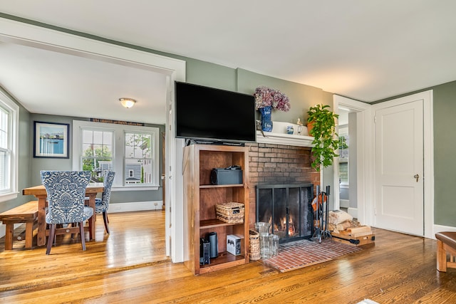 46 Haven Rd, South Portland, ME 04106 - living area featuring light wood-type flooring and a brick fireplace