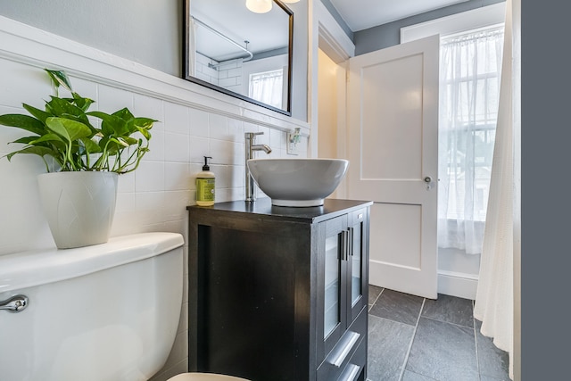 46 Haven Rd, South Portland, ME 04106 - bathroom with vanity, tile walls, and tile patterned flooring