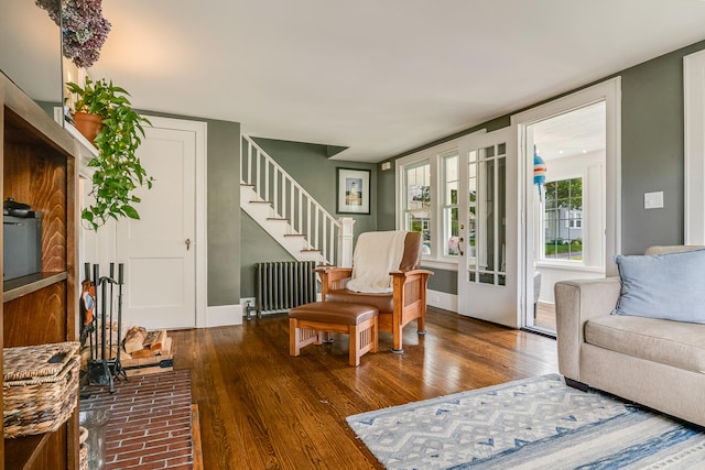 46 Haven Rd, South Portland, ME 04106 - living area with radiator, wood finished floors, and stairs