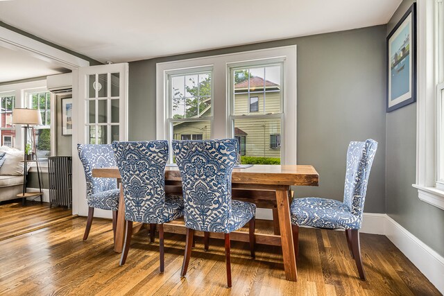 46 Haven Rd, South Portland, ME 04106 - dining area featuring wood finished floors and a wall mounted air conditioner