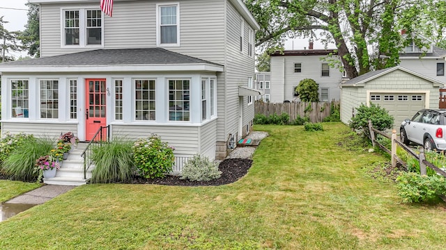 46 Haven Rd, South Portland, ME 04106 - american foursquare style home featuring a garage, a shingled roof, and an outbuilding