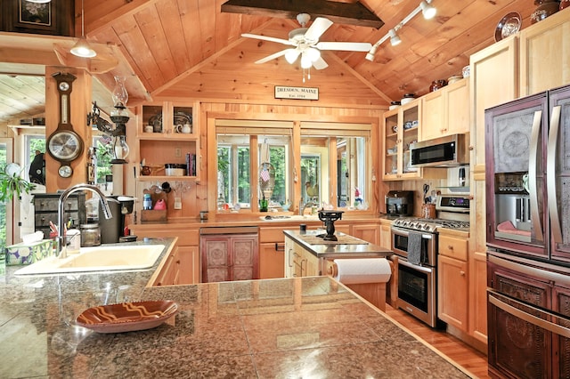 16 Brackett Rd, Dresden, ME 04342 - kitchen with stainless steel appliances, open shelves, rail lighting, wooden ceiling, and light wood-type flooring