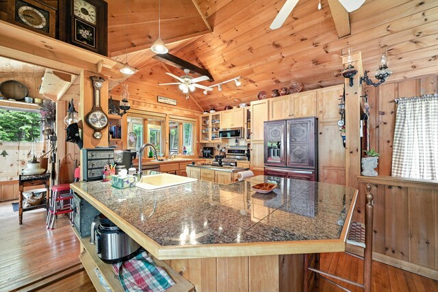 16 Brackett Rd, Dresden, ME 04342 - kitchen featuring tile countertops, stainless steel appliances, a ceiling fan, hardwood / wood-style flooring, and a breakfast bar