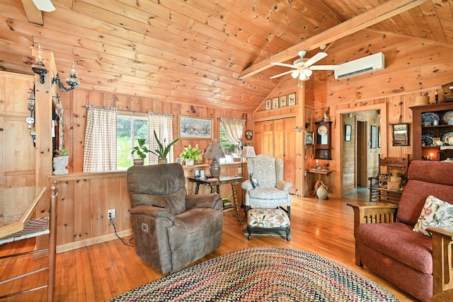 16 Brackett Rd, Dresden, ME 04342 - living area featuring a ceiling fan, wood walls, hardwood / wood-style floors, a wall unit AC, and wood ceiling