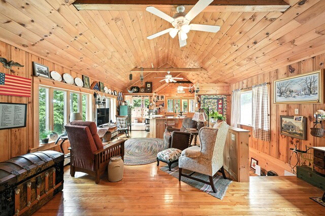 16 Brackett Rd, Dresden, ME 04342 - living room featuring ceiling fan, wood walls, hardwood / wood-style flooring, wood ceiling, and lofted ceiling