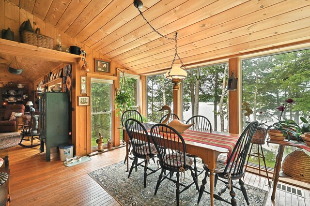 16 Brackett Rd, Dresden, ME 04342 - dining room featuring vaulted ceiling, wood ceiling, wood-type flooring, and wooden walls
