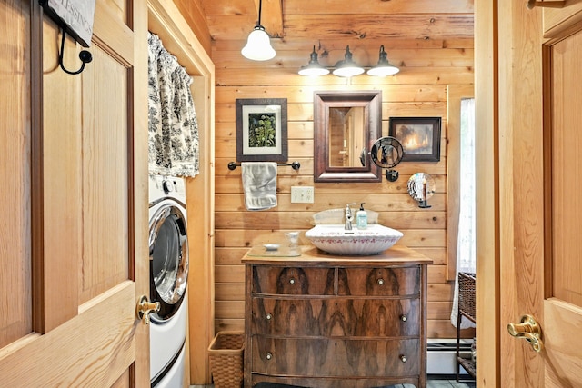 16 Brackett Rd, Dresden, ME 04342 - bathroom with washer / dryer, vanity, and wood walls