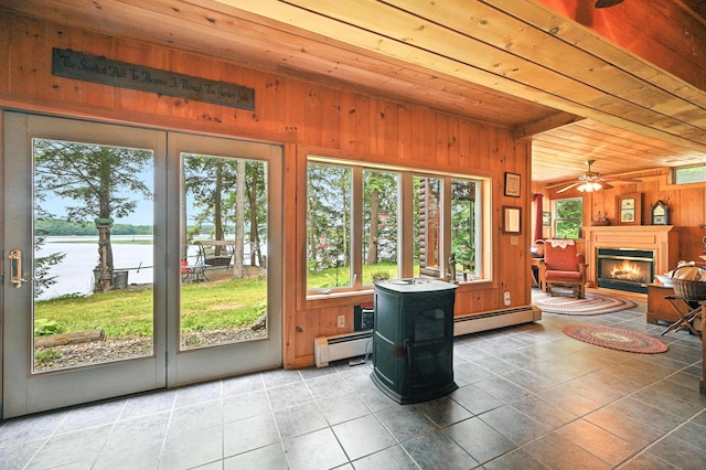 16 Brackett Rd, Dresden, ME 04342 - tiled living area featuring wood ceiling, wood walls, a baseboard radiator, and healthy amount of natural light