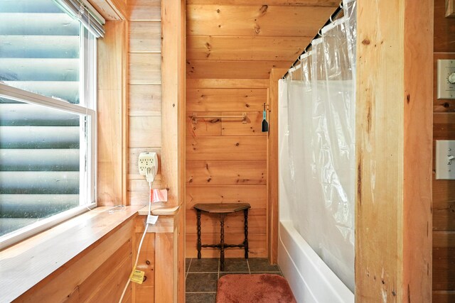16 Brackett Rd, Dresden, ME 04342 - bathroom with wooden walls, tile patterned flooring, and shower / tub combo