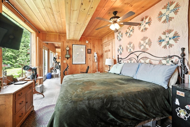 16 Brackett Rd, Dresden, ME 04342 - bedroom with wood ceiling, light tile patterned floors, and wooden walls