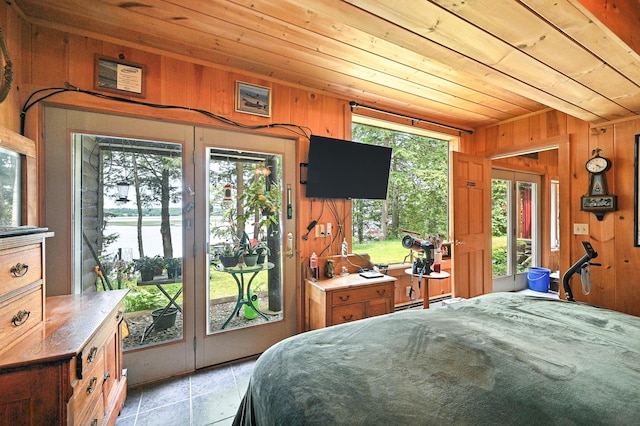 16 Brackett Rd, Dresden, ME 04342 - bedroom with wood ceiling, wood walls, access to outside, and a baseboard heating unit