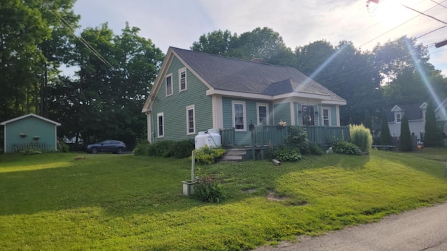 12 High St, Calais, ME 04619 - view of front of house featuring a front lawn and a deck