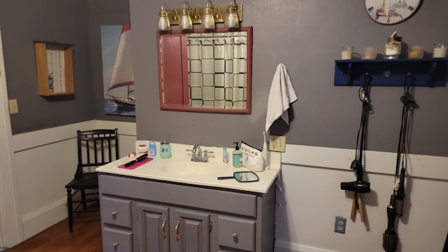 12 High St, Calais, ME 04619 - bathroom featuring vanity and wood finished floors