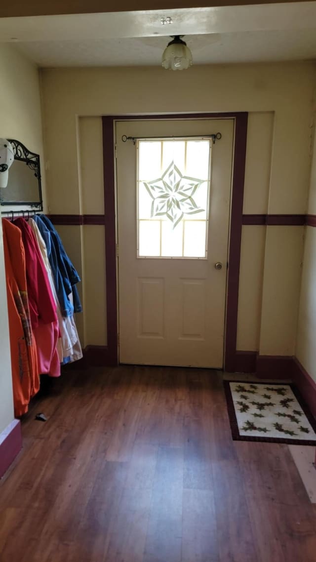 12 High St, Calais, ME 04619 - entryway featuring wood finished floors and baseboards