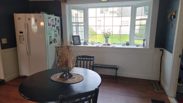 12 High St, Calais, ME 04619 - dining area featuring a wainscoted wall and wood finished floors
