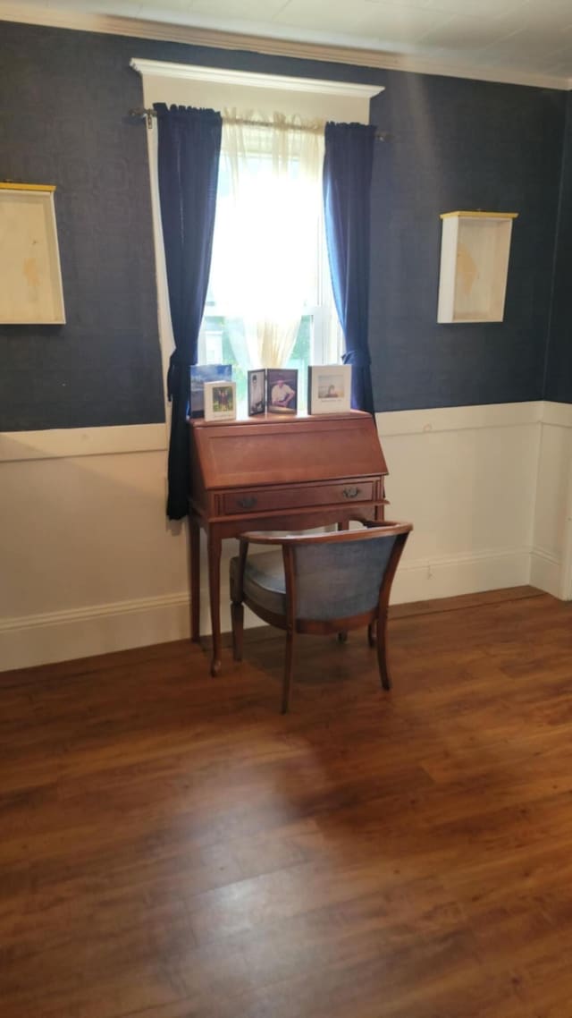 12 High St, Calais, ME 04619 - dining room featuring wood finished floors, a wainscoted wall, and crown molding