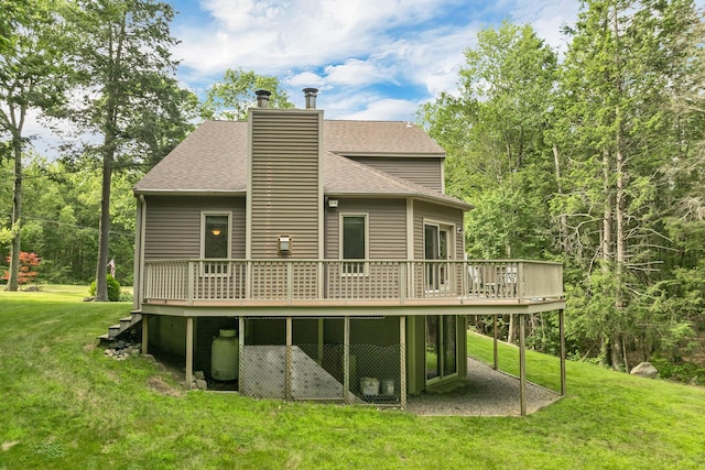125 Deer Ridge Dr, Barrington, NH 03825 - rear view of house with a deck, a shingled roof, a lawn, and a chimney