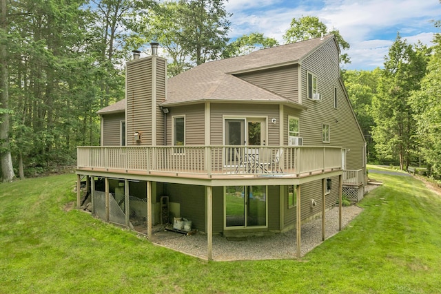 125 Deer Ridge Dr, Barrington, NH 03825 - rear view of property with a deck, roof with shingles, a chimney, and a lawn