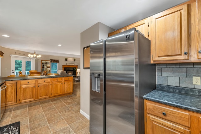 125 Deer Ridge Dr, Barrington, NH 03825 - kitchen featuring appliances with stainless steel finishes, dark countertops, a chandelier, decorative backsplash, and recessed lighting