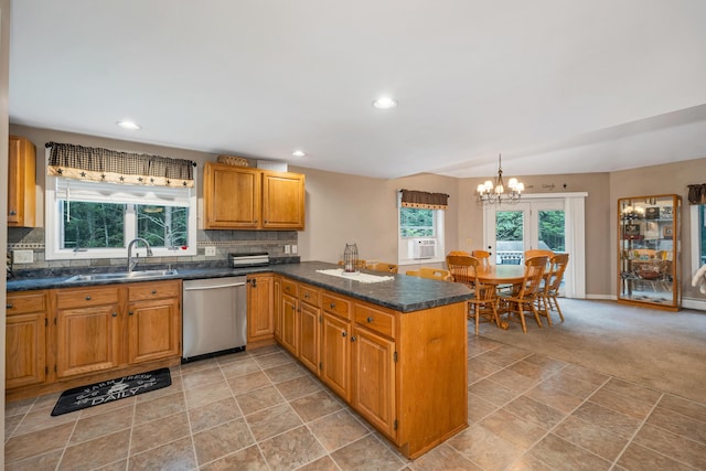 125 Deer Ridge Dr, Barrington, NH 03825 - kitchen with stainless steel dishwasher, a peninsula, a chandelier, backsplash, and recessed lighting
