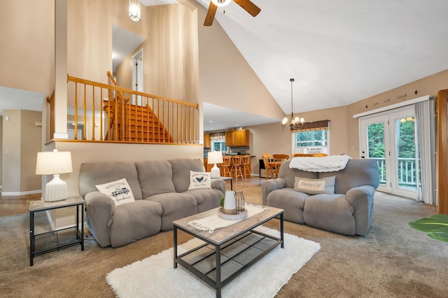 125 Deer Ridge Dr, Barrington, NH 03825 - carpeted living area with high vaulted ceiling, stairway, ceiling fan, and a chandelier