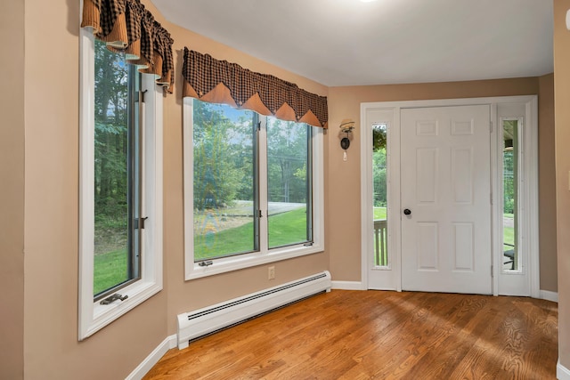 125 Deer Ridge Dr, Barrington, NH 03825 - entrance foyer with baseboard heating and wood finished floors