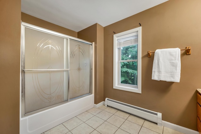 125 Deer Ridge Dr, Barrington, NH 03825 - bathroom featuring baseboard heating, vanity, combined bath / shower with glass door, and tile patterned floors