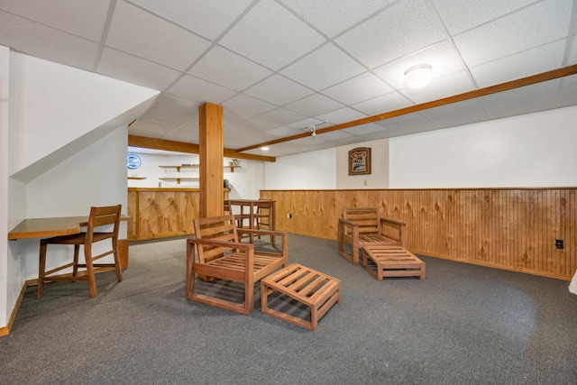 125 Deer Ridge Dr, Barrington, NH 03825 - living area featuring wainscoting, carpet flooring, wood walls, and a drop ceiling