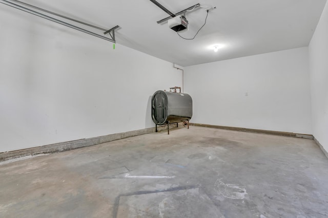 8 Woodside Dr Unit 1, Gorham, ME 04038 - garage featuring oil tank and a garage door opener