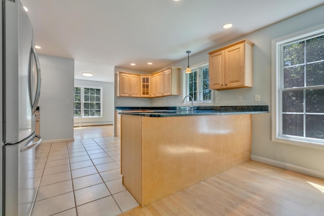 8 Woodside Dr Unit 1, Gorham, ME 04038 - kitchen with freestanding refrigerator, light brown cabinetry, decorative light fixtures, a peninsula, and recessed lighting