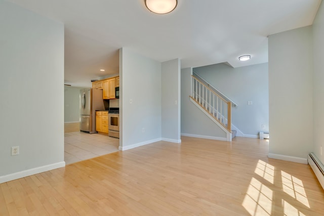 8 Woodside Dr Unit 1, Gorham, ME 04038 - unfurnished living room with light wood-type flooring, stairway, baseboard heating, and recessed lighting