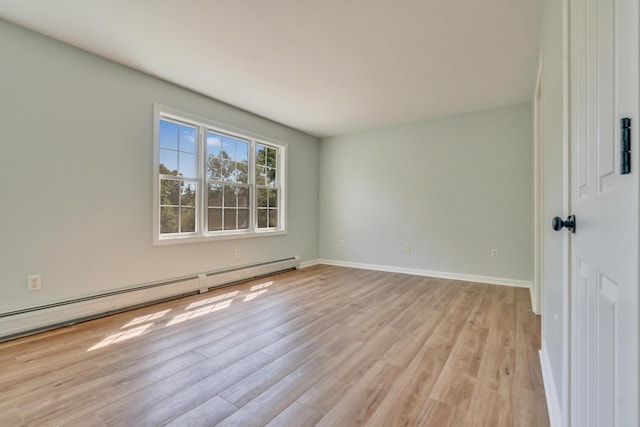 8 Woodside Dr Unit 1, Gorham, ME 04038 - unfurnished room featuring a baseboard heating unit and light wood-type flooring