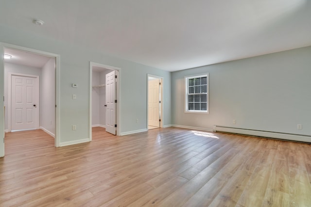 8 Woodside Dr Unit 1, Gorham, ME 04038 - unfurnished room with a baseboard radiator, light wood-style floors, and a smoke detector