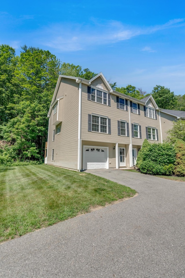 8 Woodside Dr Unit 1, Gorham, ME 04038 - view of front facade featuring a garage, driveway, and a front lawn