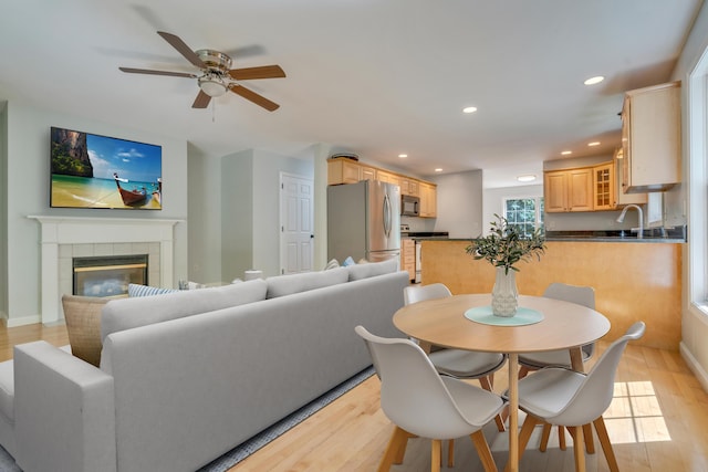 8 Woodside Dr Unit 1, Gorham, ME 04038 - dining space featuring light wood-style floors, a ceiling fan, recessed lighting, and a fireplace