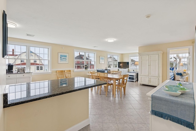 42 Rachel Carson Ln, Wells, ME 04090 - dining space with plenty of natural light and light tile patterned flooring